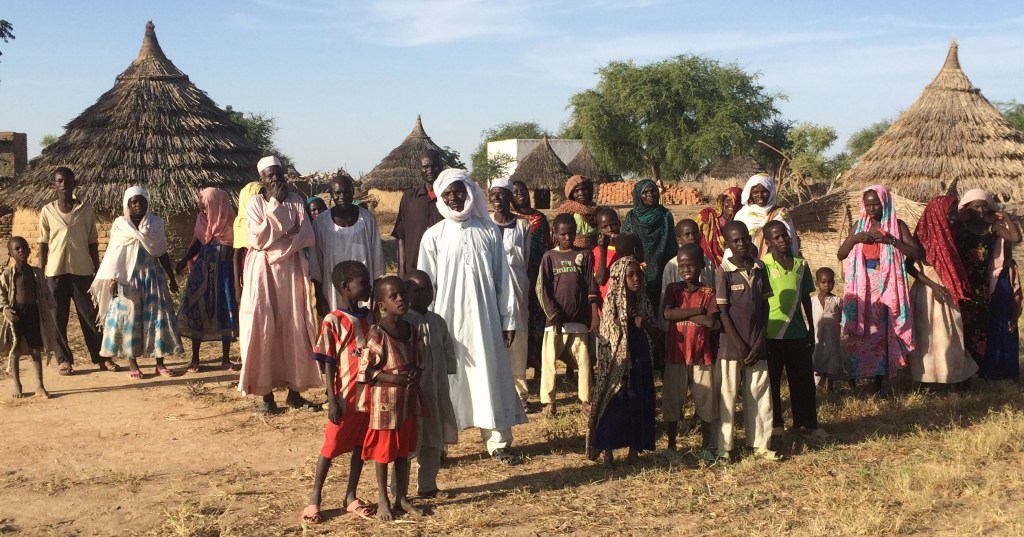 The chief and people of the community prepare to be filmed on the last day of our shoot